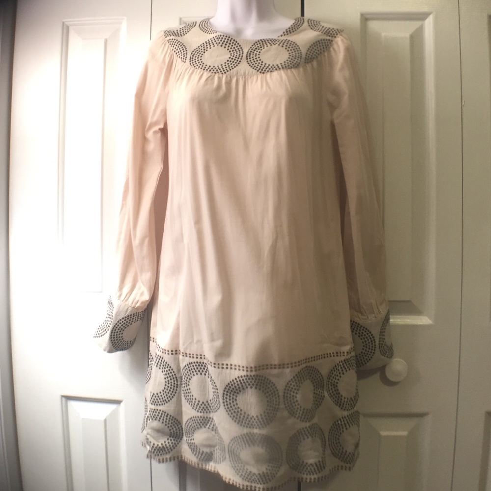 Long sleeve cream dress with circle detail